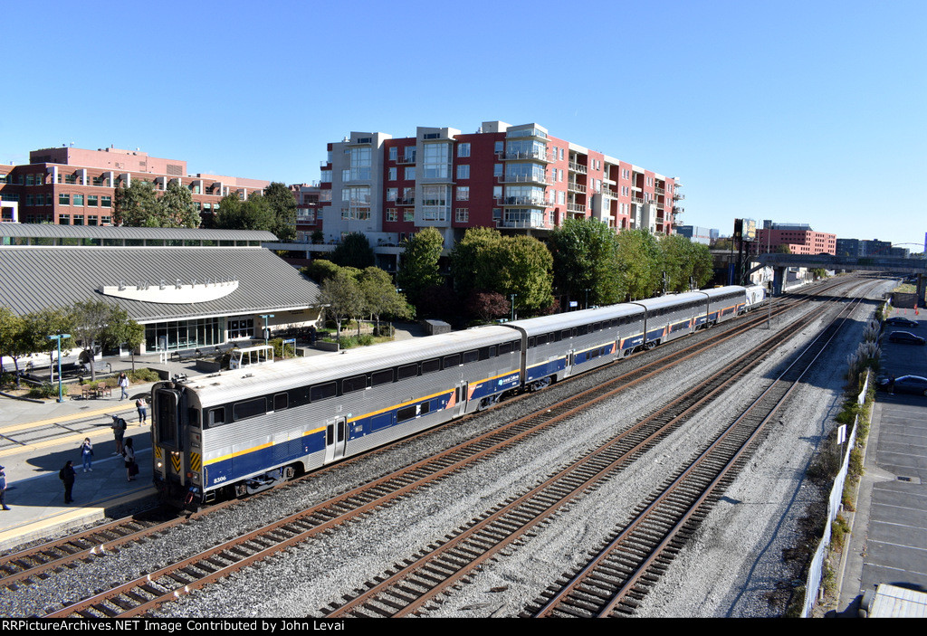 Amtrak Train # 536, heading from Oakland Jack London Square to Sacramento, slows for the stop with Amtrak California Bilevel Cab Control Car # 8306 on the point 